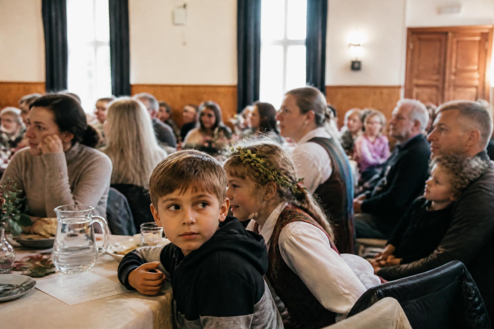 Lithuanian families and children together at a community gathering in the United Kingdom